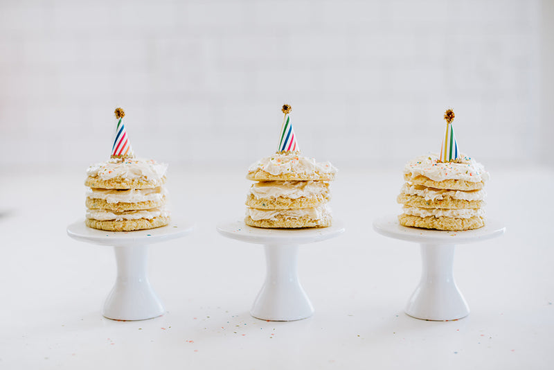 3 Keto Birthday Cake Cookie Sandwiches with Frosting and Sprinkles, Topped with Birthday Hats