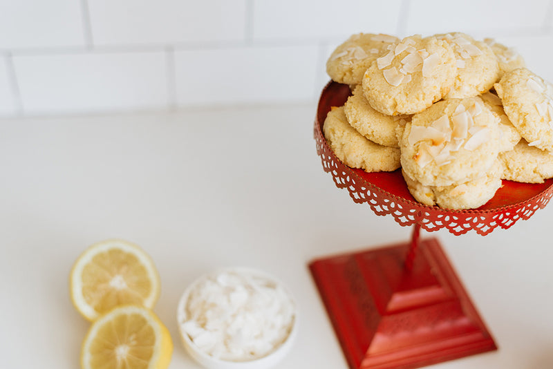 Lemon Coconut Keto Butter Cookies on Red Stand