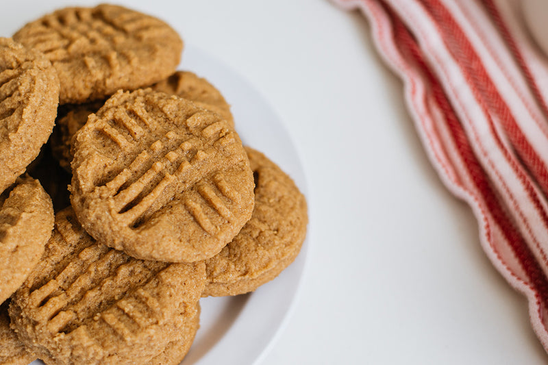 Plate of Keto Peanut Butter Cookies with Red Kitchen Towel