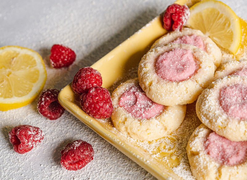 Lemon Raspberry Keto Butter Cookies with Frosting on Yellow Plate